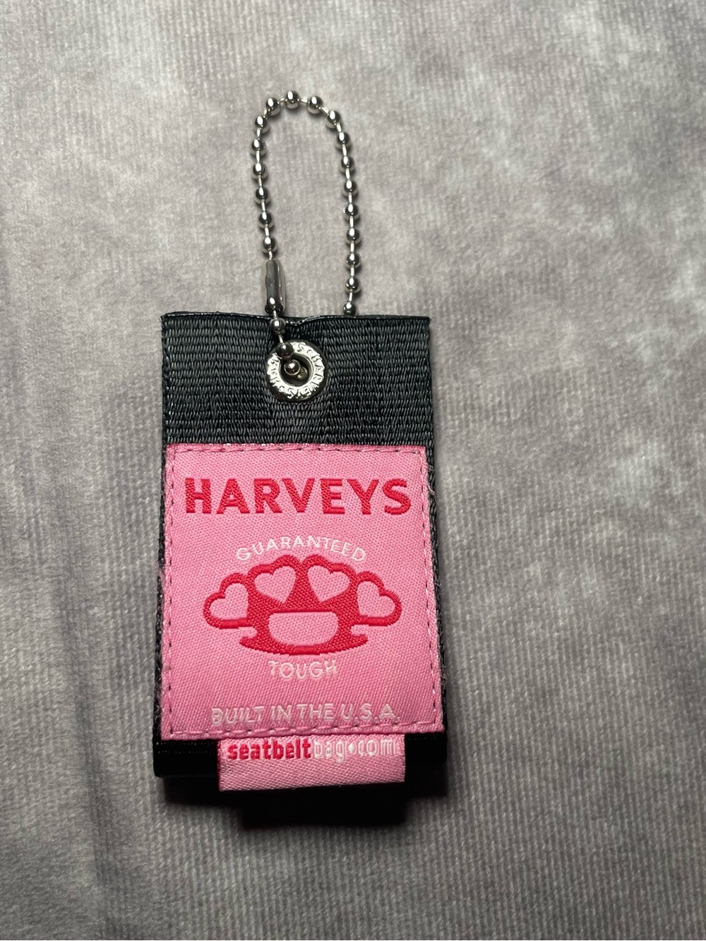 Harvey’s seatbelt brand tough love hangtag